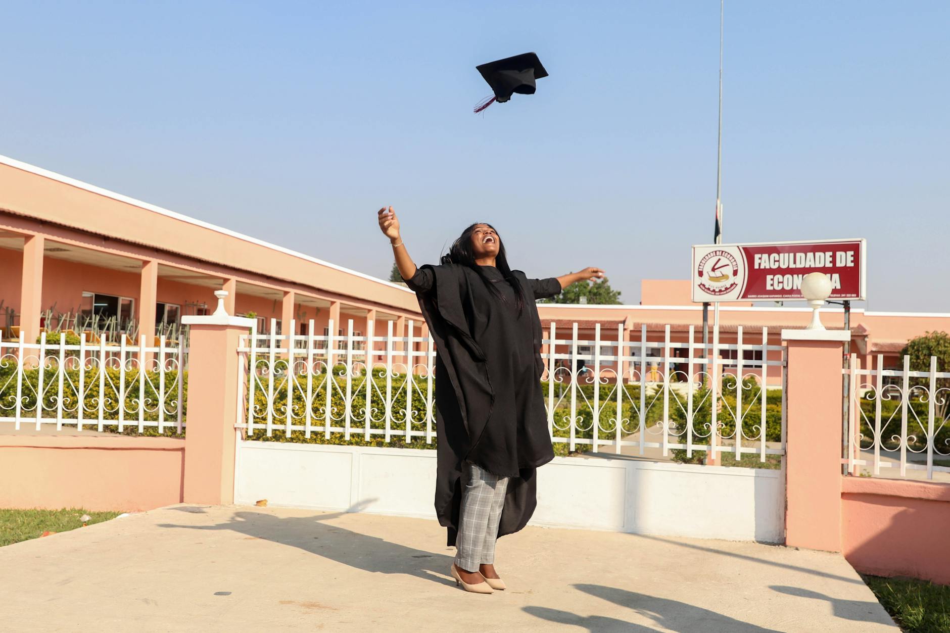 woman tossing her hat